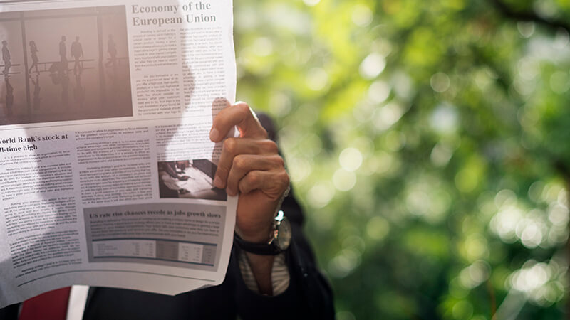 Man reading about a US newspapers' attack