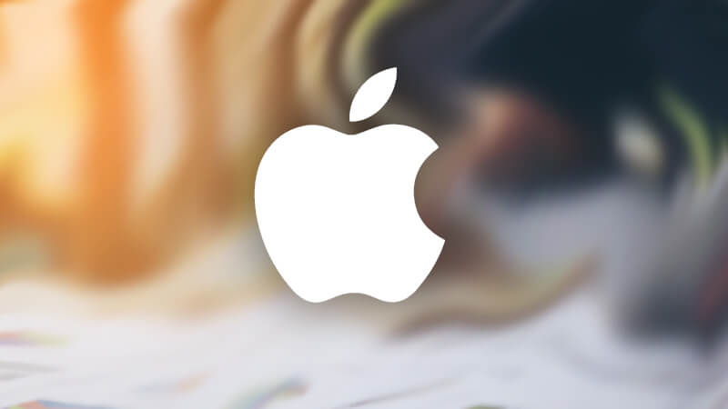 Apple logo above a blurry phishing scam